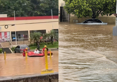 Enxurrada invade ruas, com&eacute;rcios e casas; Bombeiros usam bote para resgates